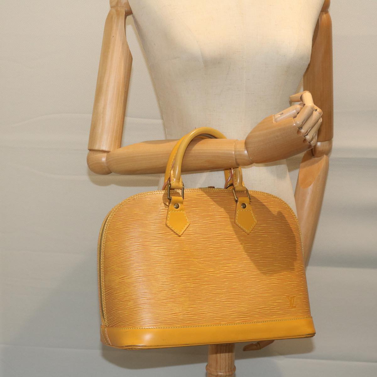 Louis Vuitton Alma Yellow Leather Handbag