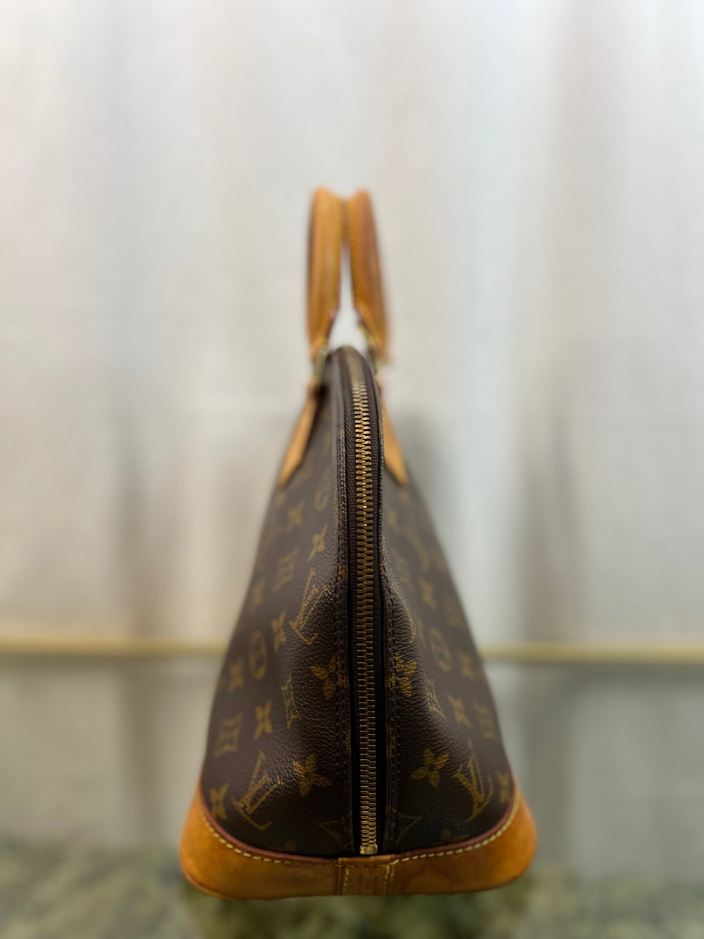 LOUIS VUITTON Monogram Alma PM Satchel
