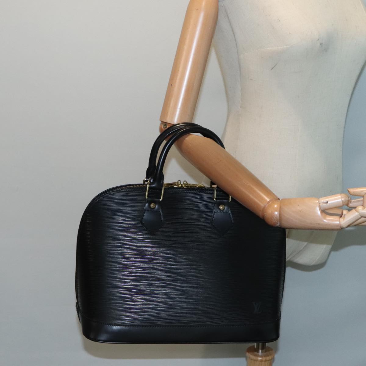 Louis Vuitton Alma Black Leather Handbag