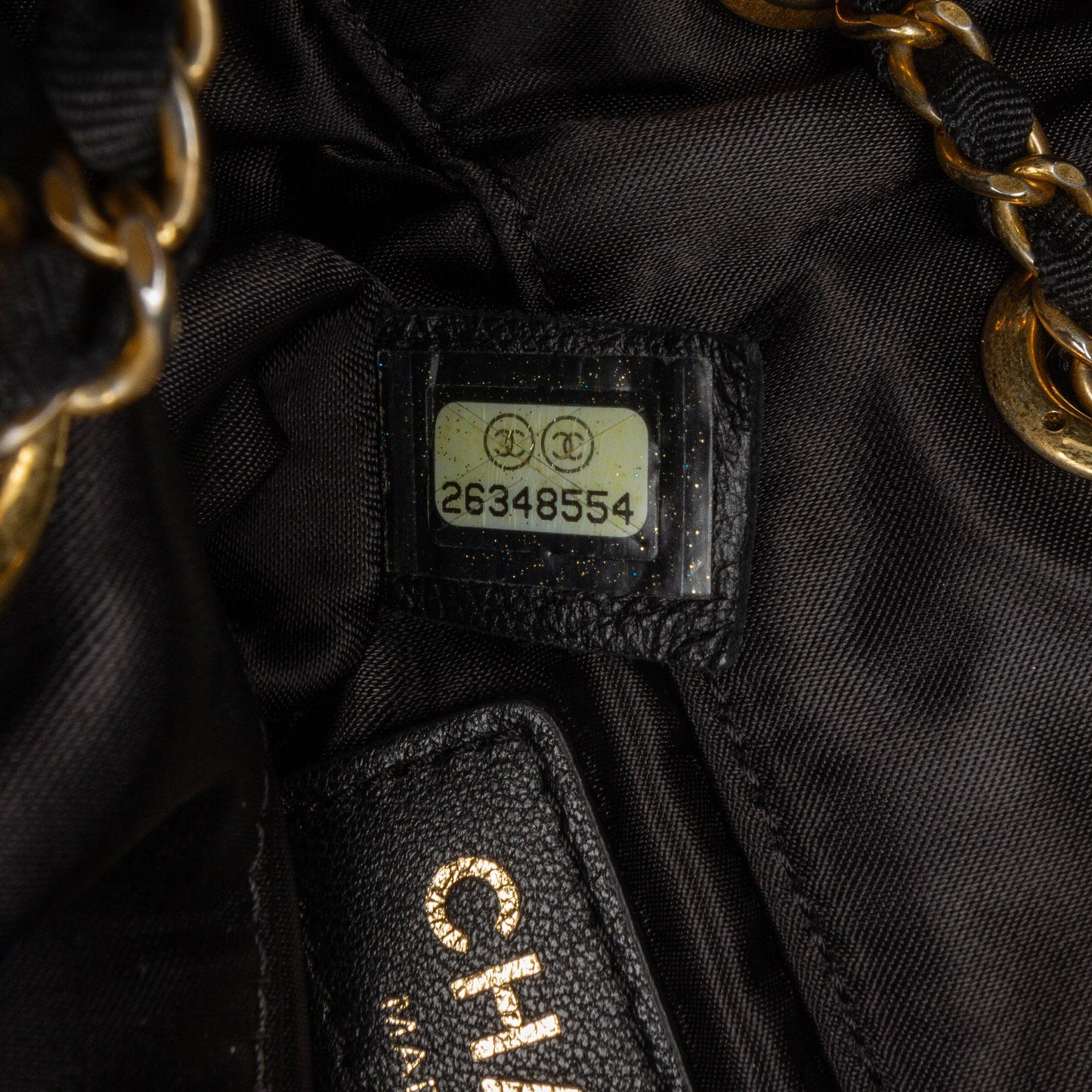 Chanel Quilted Nylon Crystal CC Drawstring Sling Bag